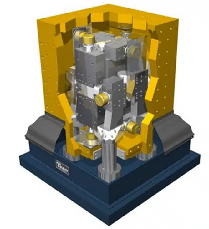 Rendu 3D de la plateforme d'excitation 6 axes (le Cube) d'AVNIR Engineering, cube jaune et vérins sur massif suspendu